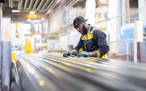 Man working at Pipelife pipe manufacturing plant